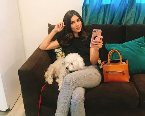 Camila Banus with her pet dog Kiwi Banus